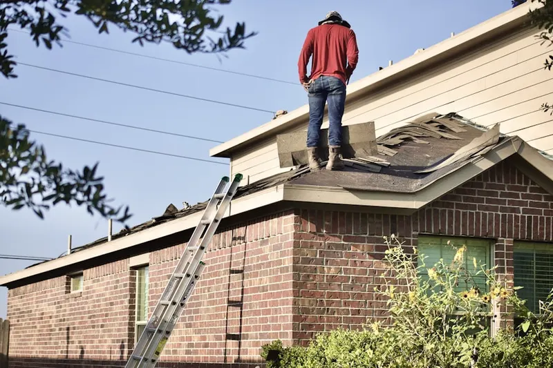 Professional roofer working on a residential roof in Bridgestone Ranch